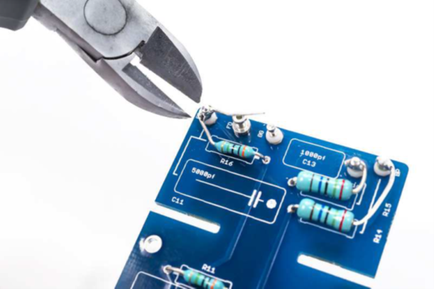 Close-up of R11/R16 solder joint quality check.